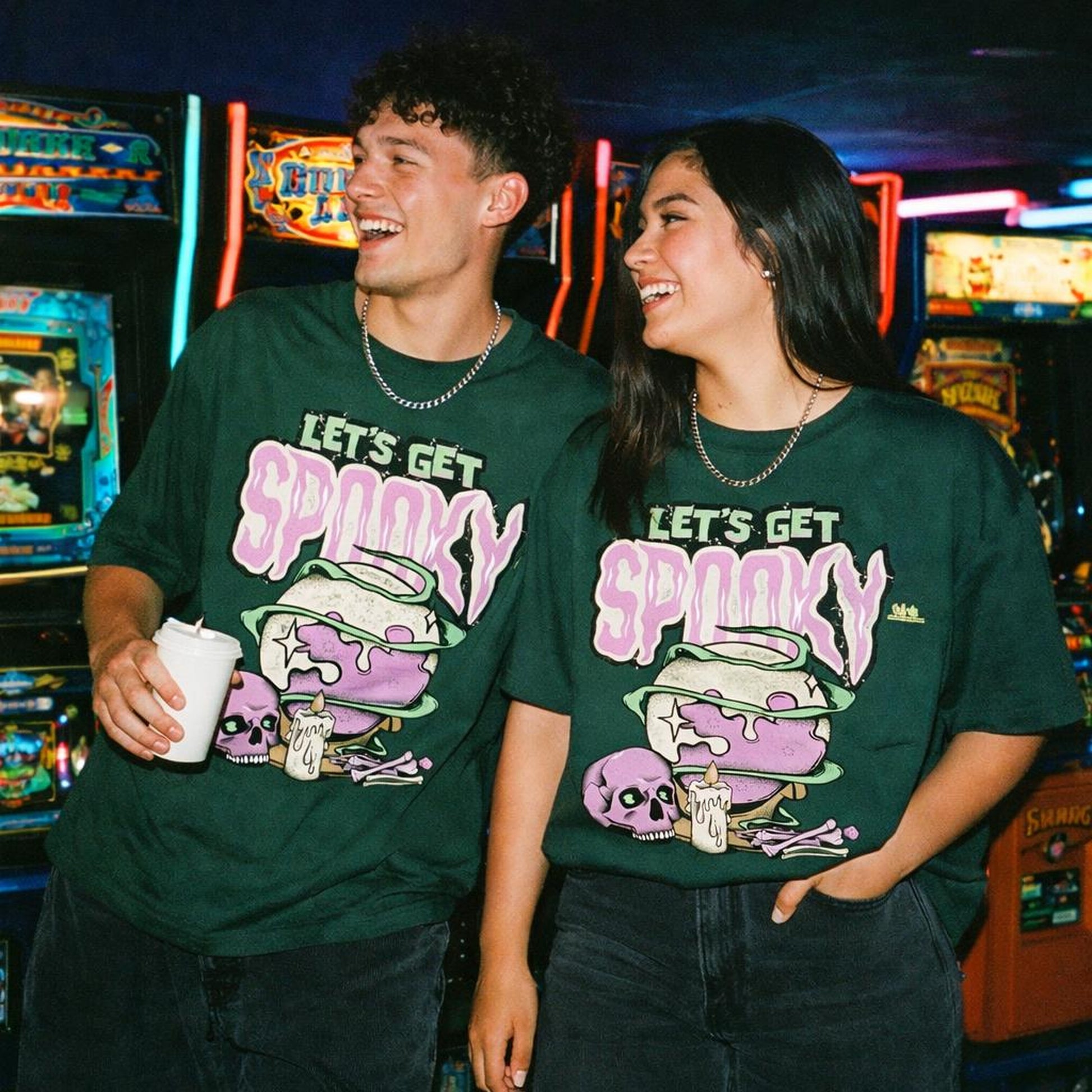Spooky Feast | Oversized T-Shirt | Bottle Green · on a man and a woman