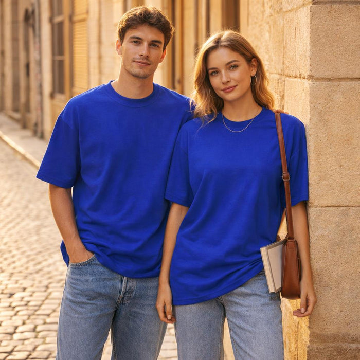 Royal Blue Classic | Oversized T-Shirt | 100% Cotton · on a man and a woman